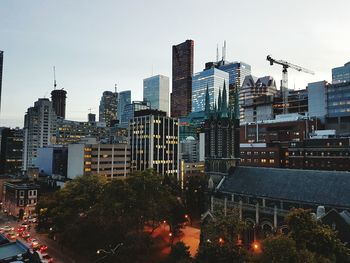 View of skyscrapers lit up at night