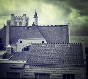 Low angle view of building against cloudy sky