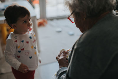 Grandmother with girl at home