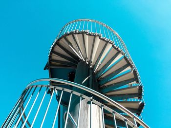 Low angle view of staircase against clear blue sky