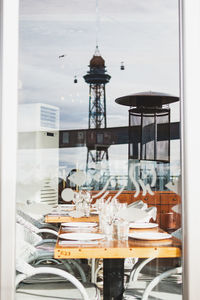 Chairs and tables in glass window