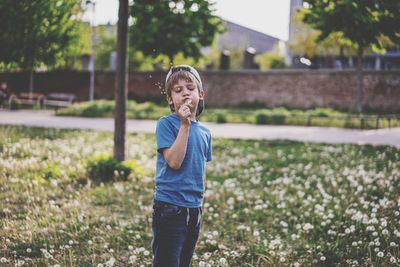 Portrait of boy standing outdoors