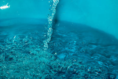 Close-up of water splashing in swimming pool