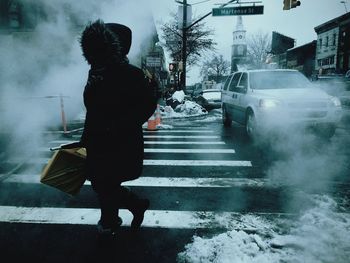 Full length of woman walking in city