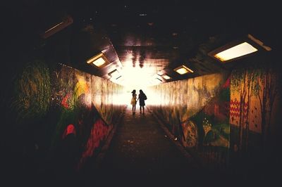 People walking in tunnel