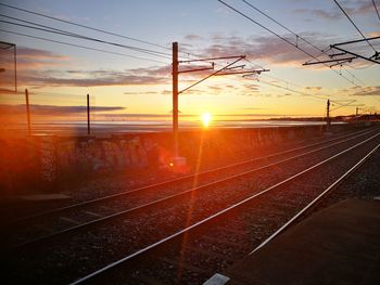 View of railway tracks at sunset