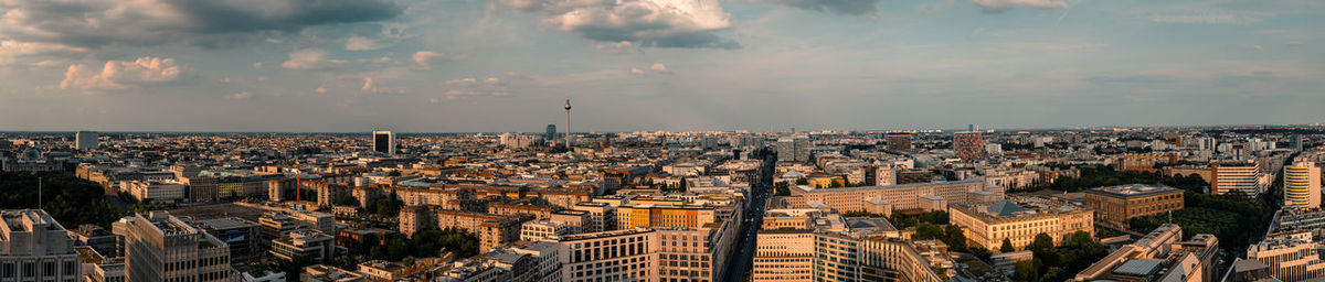 High angle view of buildings against cloudy sky