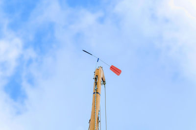 Low angle view of windmill against sky