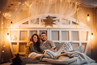 Young couple kissing on bed