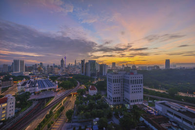 High angle view of city at sunset