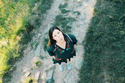 Portrait of smiling young woman standing outdoors