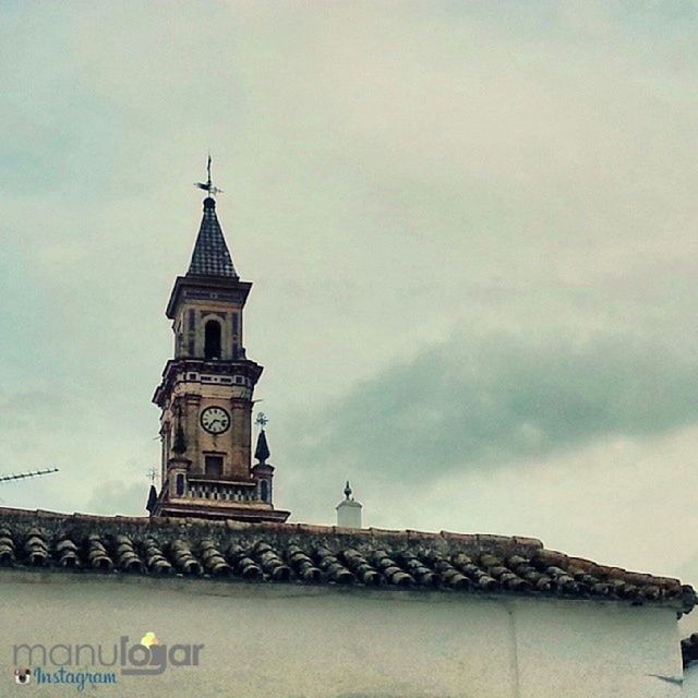 building exterior, architecture, built structure, religion, low angle view, church, place of worship, sky, spirituality, high section, clock tower, cross, cloud - sky, tower, roof, clock, day, outdoors