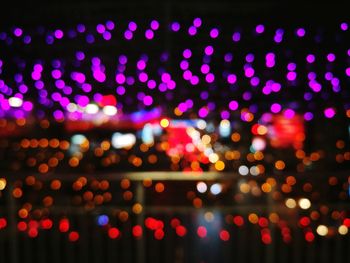 Defocused image of illuminated lights at night