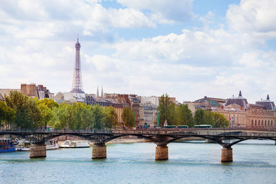 Bridge over river with city in background