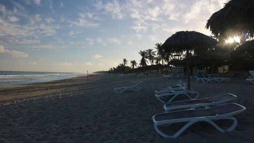 Scenic view of beach against sky during sunset