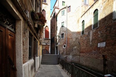 Walkway amidst buildings