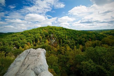 Scenic view of mountains against cloudy sky