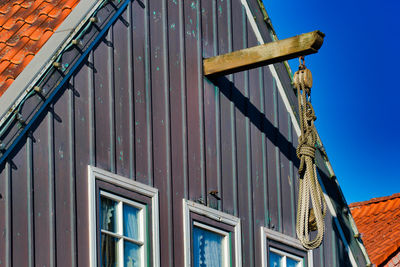 Low angle view of building against clear blue sky