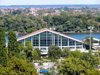 High angle view of trees and buildings in city