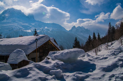 Scenic view of snowcapped mountains against sky