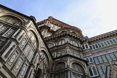 Low angle view of ornate building against sky