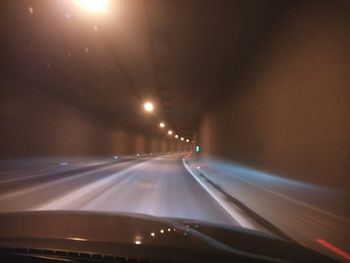 View of car moving on road at night