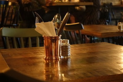 Close-up of beer glass on table