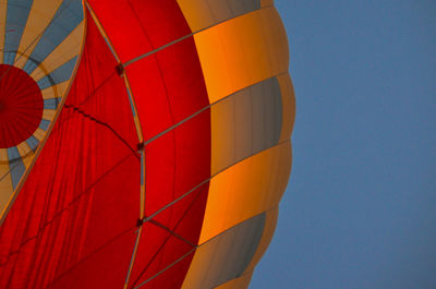 Low angle view of hot air balloon against clear blue sky