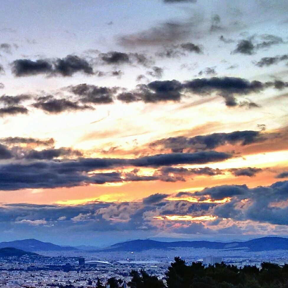 sunset, scenics, sky, mountain, beauty in nature, tranquil scene, cloud - sky, tranquility, nature, mountain range, orange color, idyllic, cloudy, cloud, water, landscape, weather, non-urban scene, outdoors, dramatic sky