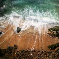 Close-up of sea waves rushing towards shore