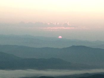 Scenic view of mountains against sky during sunset