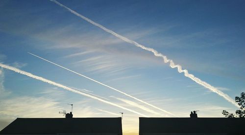 Low angle view of vapor trails in sky