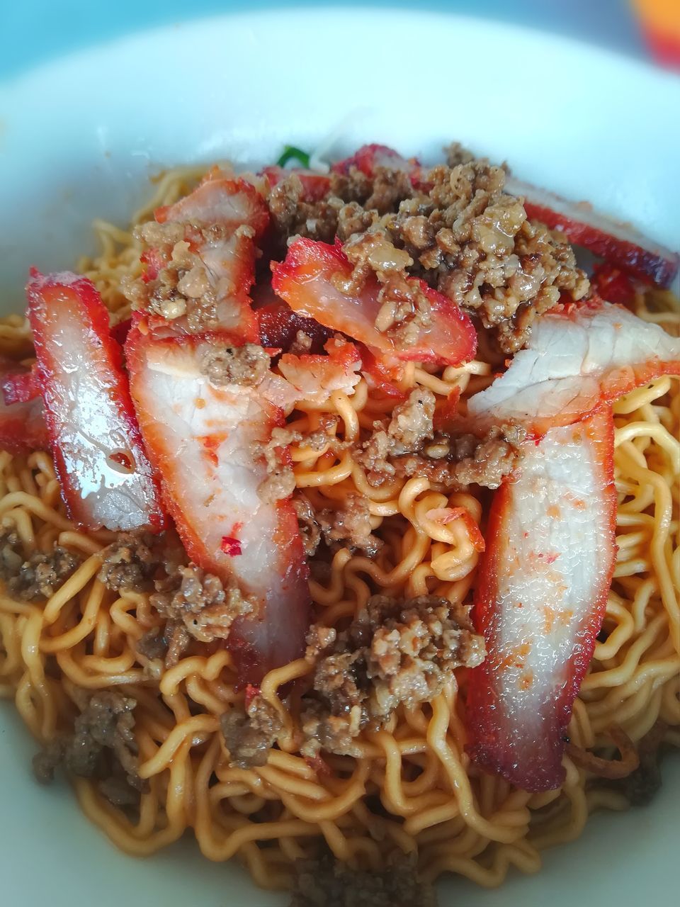 CLOSE-UP OF NOODLES SERVED IN PLATE WITH SAUCE