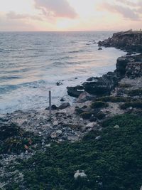 Scenic view of sea against sky at sunset