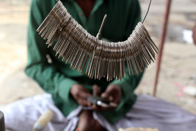 Low section of man selling keys in market