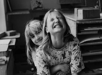 Close-up of smiling girl at home