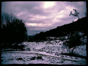 Scenic view of landscape against cloudy sky