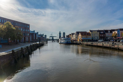 View of river against sky in city