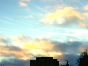 Low angle view of cloudy sky at sunset