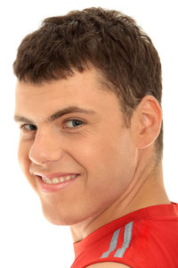 Portrait of a smiling young man against white background