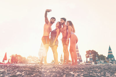 Group of people against sky in the beach