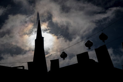 Low angle view of building against cloudy sky