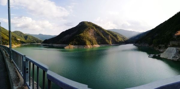 Scenic view of lake and mountains against sky