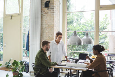 Male and female architects discussing and planning at home office