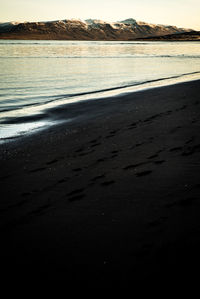 Scenic view of beach against sky during sunset