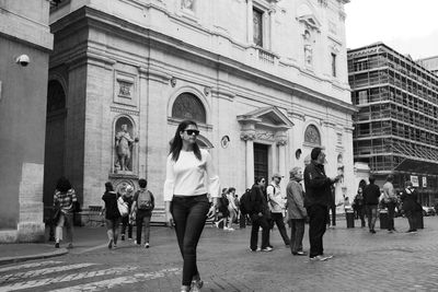 Group of people in front of buildings