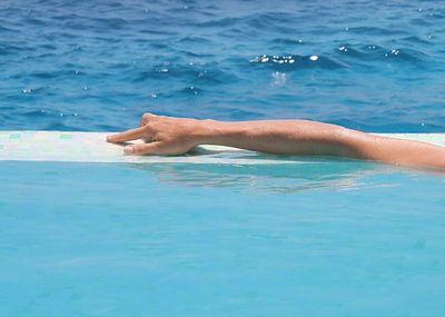 Cropped image of woman in swimming pool