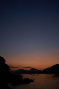 Scenic view of sea against clear sky during sunset