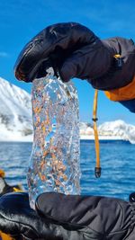 Rear view of man standing in boat