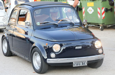 Close-up of vintage car on road